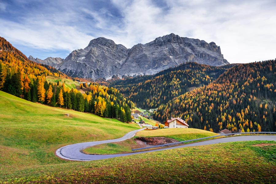 Winding road in the Dolomite Alps in autumn